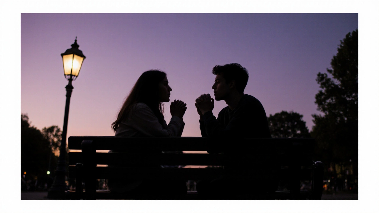 Two people sitting quietly on a park bench at dusk, sharing a moment of calm connection.
