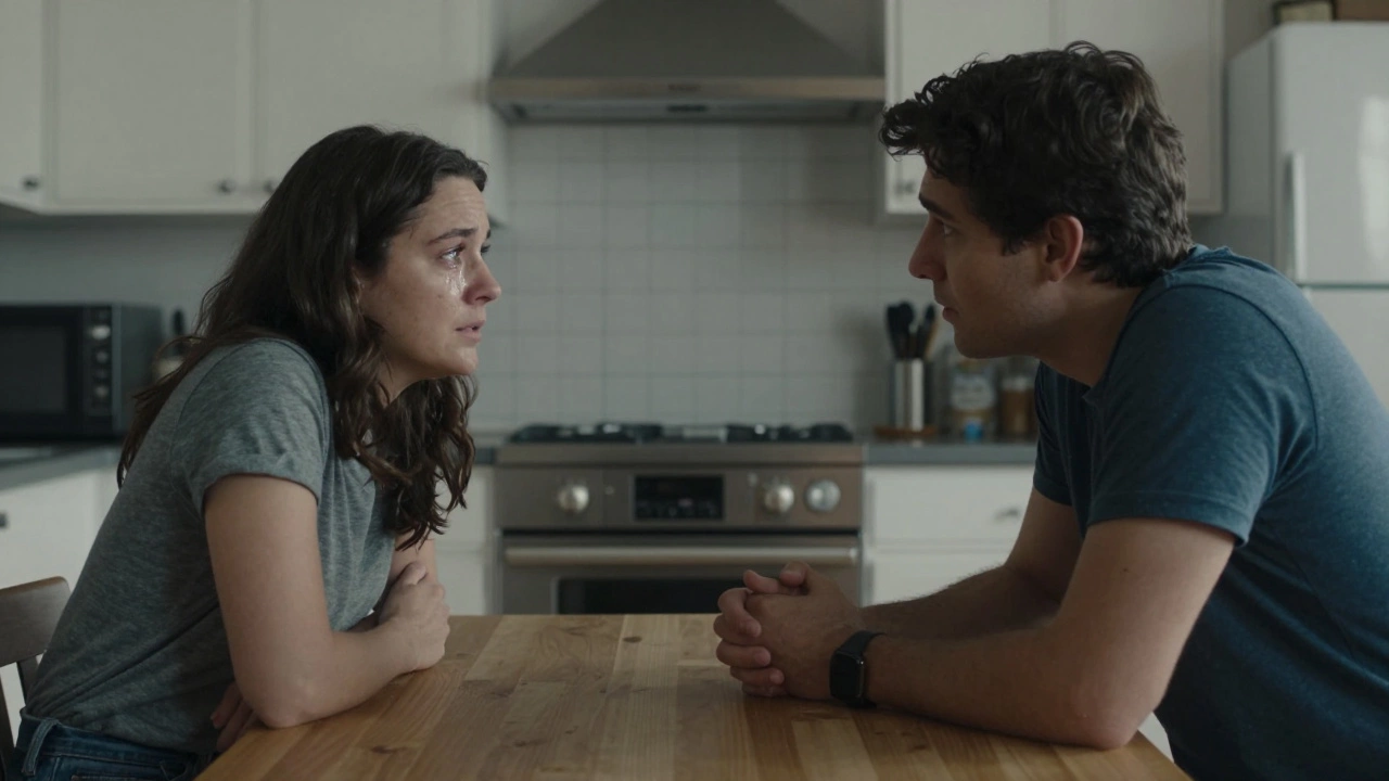 Two people in a kitchen, one listening intently during an argument, showing emotional presence without conflict.