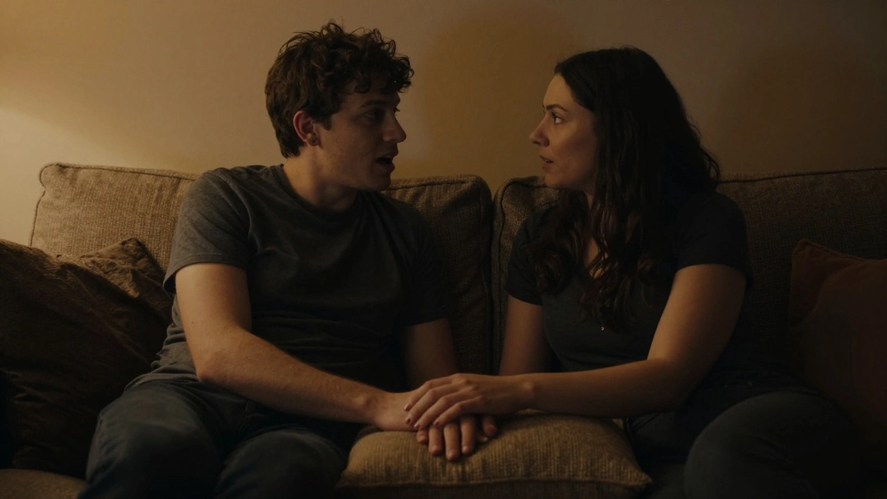 A couple in a dimly lit room sharing an intimate and honest conversation