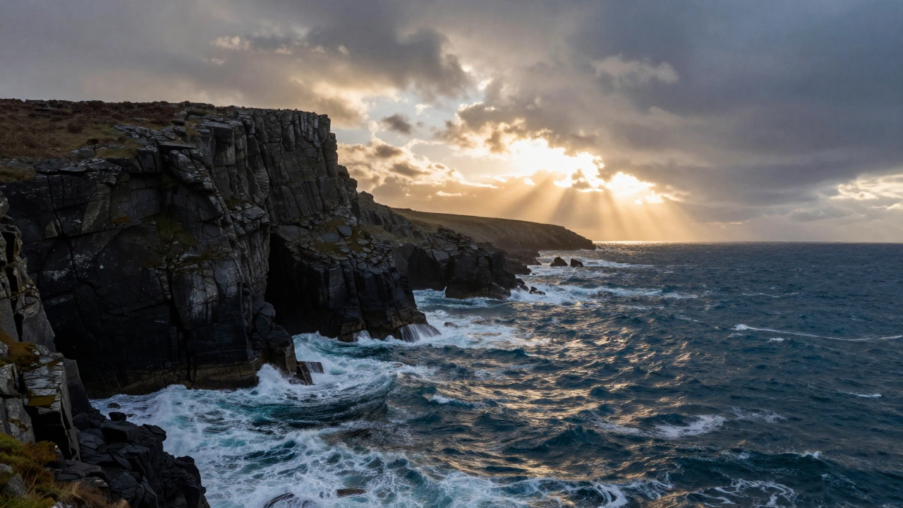Dramatic high cliffs of the Lizard Peninsula in Cornwall with crashing Atlantic Ocean waves
